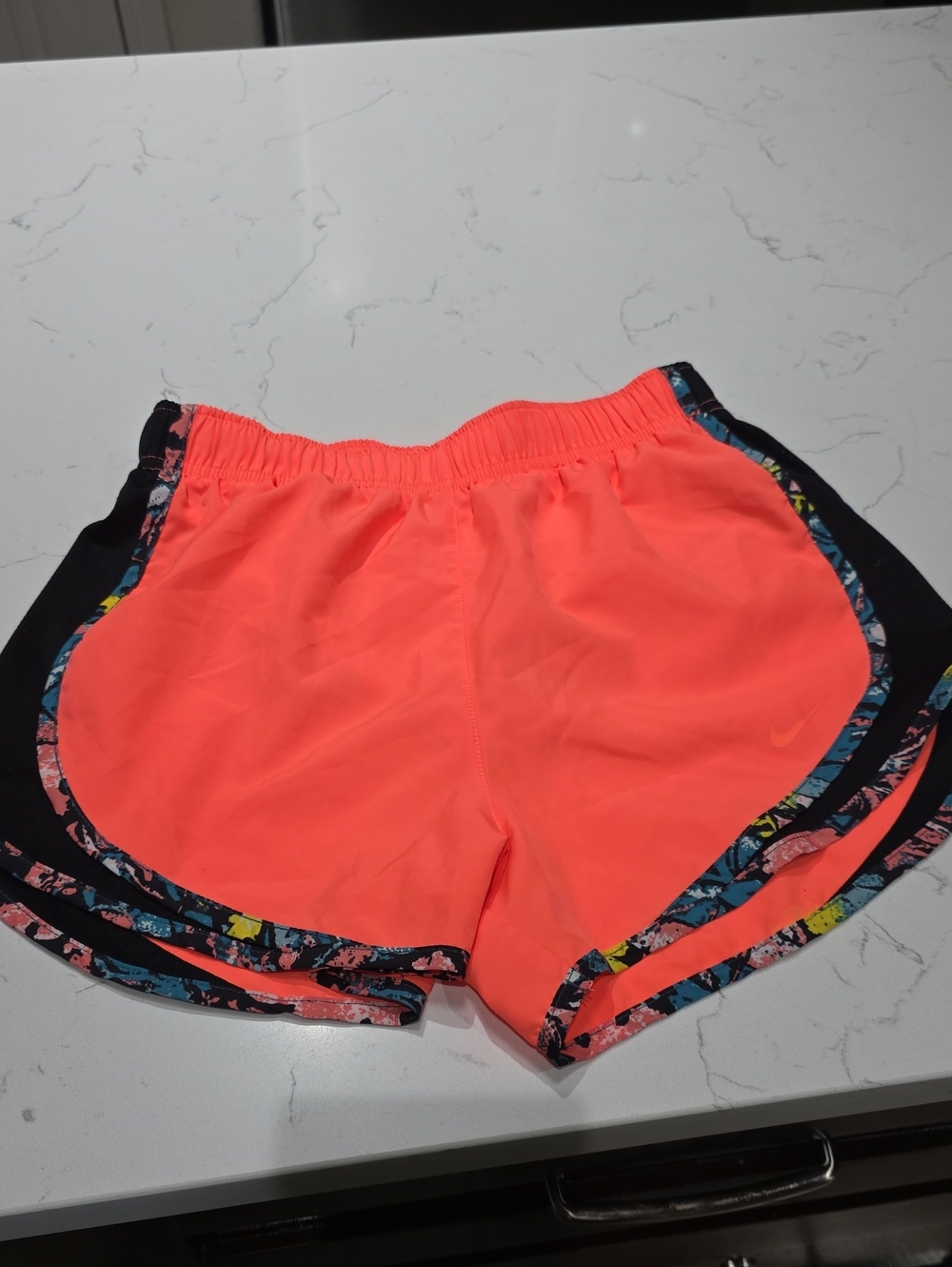 Nike Women’s Neon Coral Running Shorts with Printed Trim. Size XS.